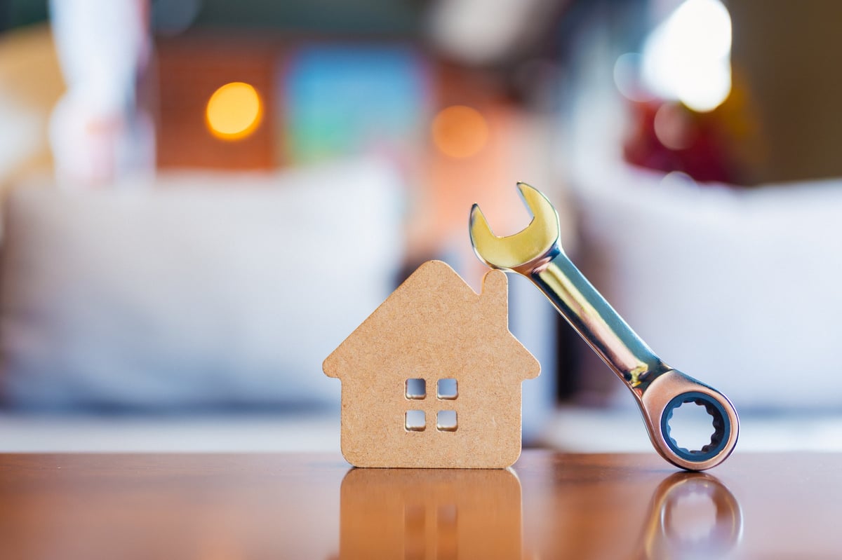 House model with a wrench symbolising property maintenance